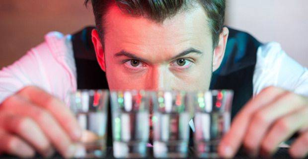 Barman Studying Shot Glasses